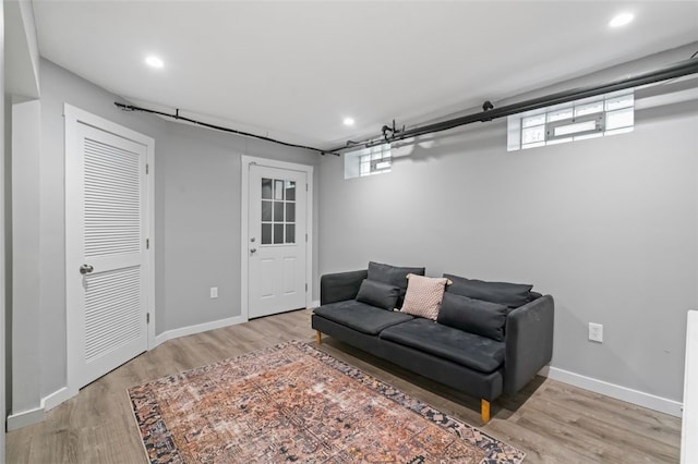 6649 Kinsman Rd, Squirrel Hill, PA 15217 - living room with recessed lighting, wood finished floors, and a healthy amount of sunlight