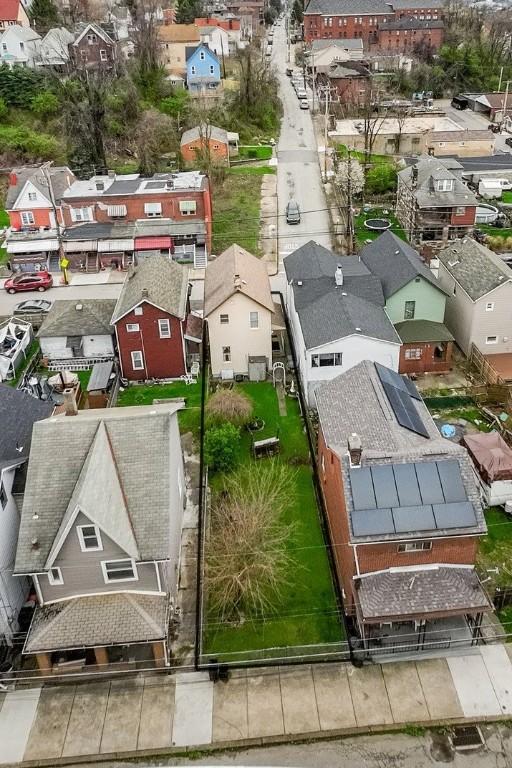 birds eye view of property with a residential view