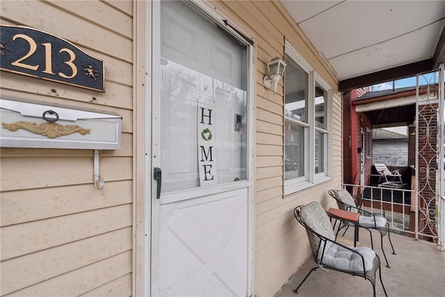 property entrance with covered porch
