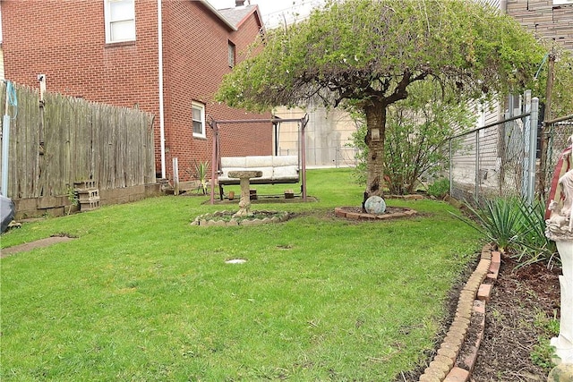 view of yard with a fenced backyard