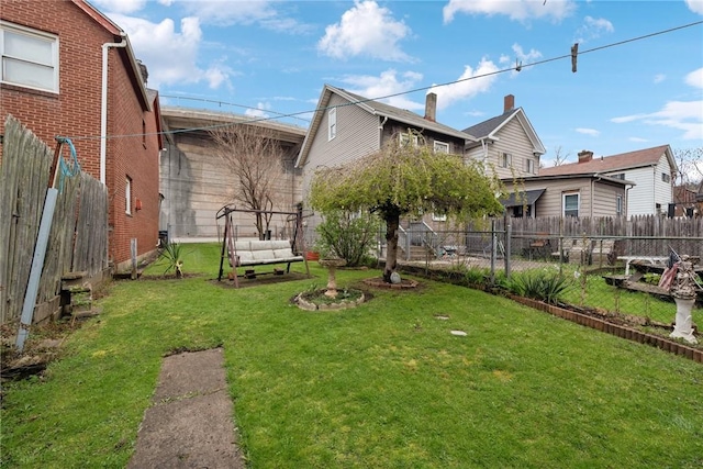 view of yard with a fenced backyard