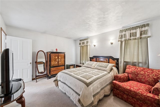 bedroom with light colored carpet