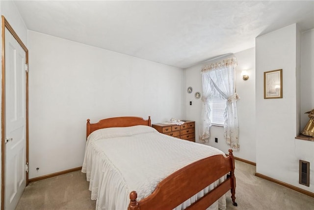 bedroom with light carpet, baseboards, and visible vents
