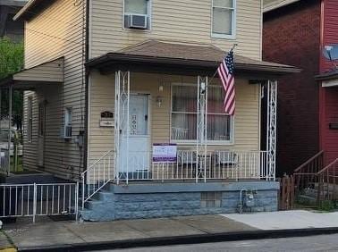 213 Fleet St, Rankin, PA 15104 - doorway to property with a porch and cooling unit