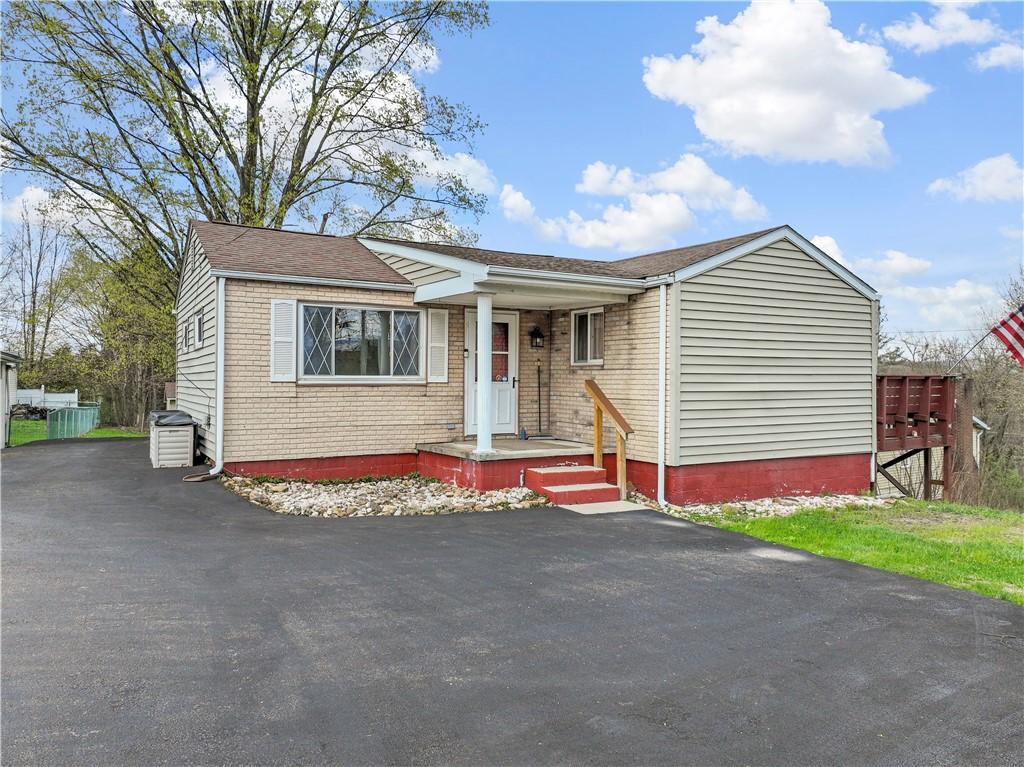 171 Buckeye Rd, East Huntingdon, PA 15666 - view of front of property with brick siding, driveway, crawl space, and a shingled roof