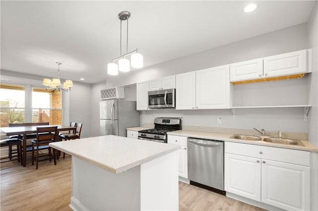 kitchen featuring light wood-style floors, recessed lighting, a sink, and stainless steel appliances