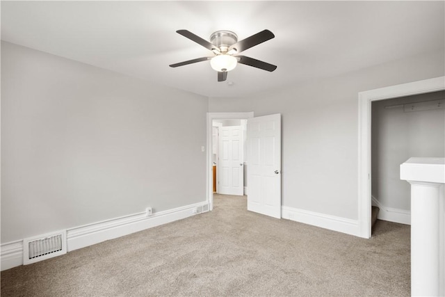 unfurnished bedroom with ceiling fan, baseboards, carpet, and visible vents