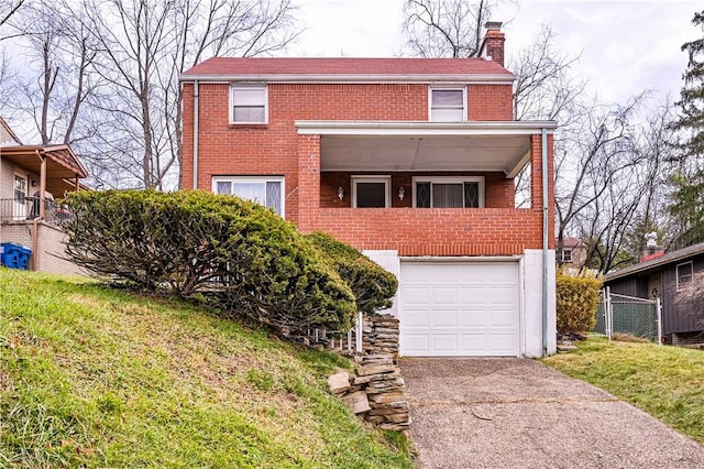 224 Churchill Rd, Wilkins Twp, PA 15145 - view of front of home featuring brick siding, an attached garage, driveway, and a chimney