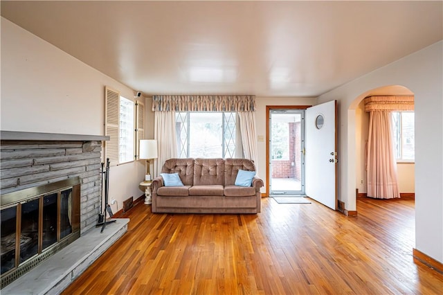 224 Churchill Rd, Wilkins Twp, PA 15145 - living area featuring arched walkways, wood finished floors, and plenty of natural light