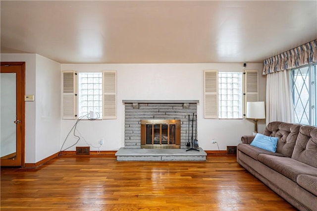224 Churchill Rd, Wilkins Twp, PA 15145 - living area with baseboards, wood finished floors, and a fireplace