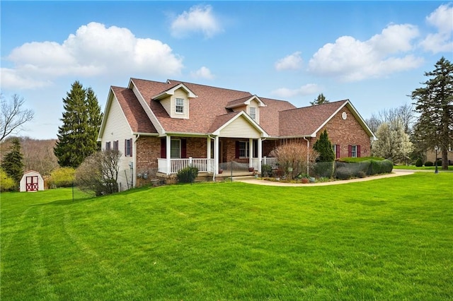 105 Hillcrest Rd, Penn Twp But, PA 16053 - cape cod house with covered porch, brick siding, a front yard, and roof with shingles