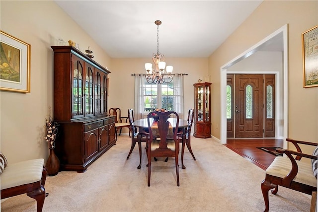 105 Hillcrest Rd, Penn Twp But, PA 16053 - dining space with a chandelier, light colored carpet, and baseboards
