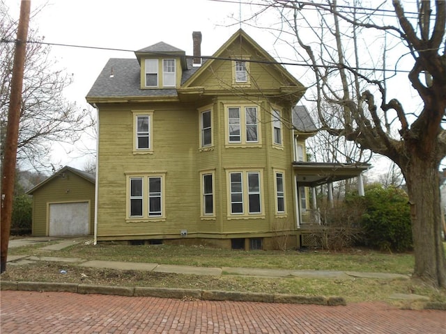 198 W Pearl St, City Of But Nw, PA 16001 - exterior space featuring an outbuilding, a garage, and decorative driveway