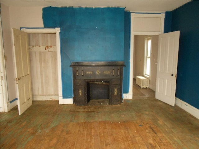 198 W Pearl St, City Of But Nw, PA 16001 - unfurnished living room with a fireplace, baseboards, and hardwood / wood-style floors