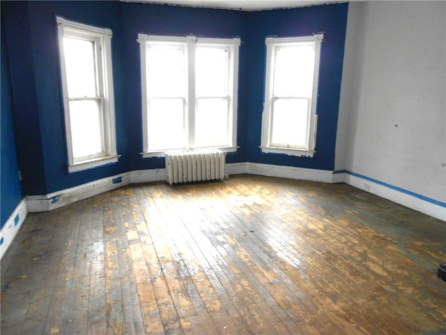 198 W Pearl St, City Of But Nw, PA 16001 - unfurnished room with wood-type flooring, baseboards, and radiator
