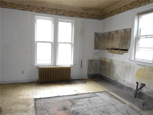 198 W Pearl St, City Of But Nw, PA 16001 - empty room with ornamental molding, radiator heating unit, and plenty of natural light
