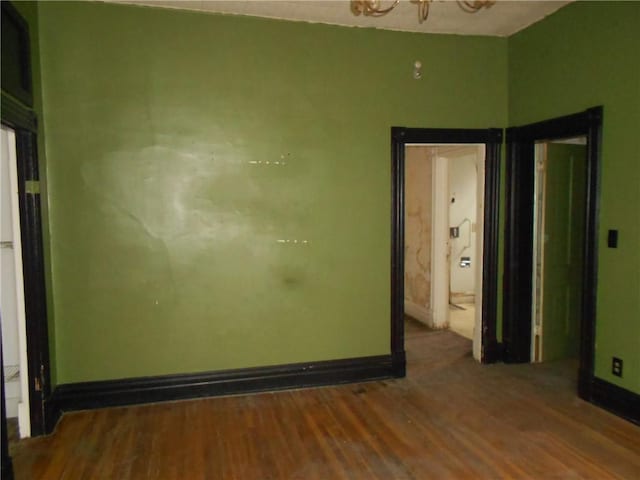 198 W Pearl St, City Of But Nw, PA 16001 - unfurnished bedroom with wood finished floors and a chandelier