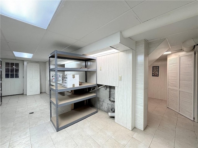 finished below grade area featuring tile patterned floors