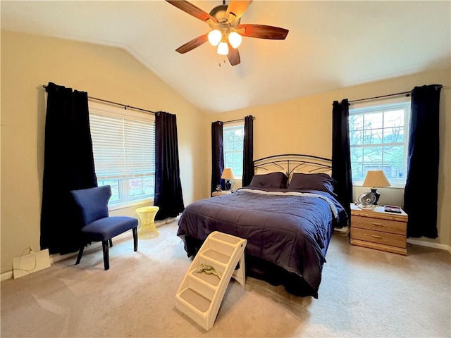 carpeted bedroom featuring a ceiling fan and lofted ceiling