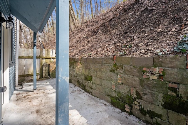 view of patio / terrace featuring fence