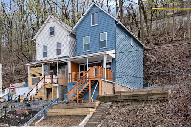 view of front of house featuring a porch and stairs