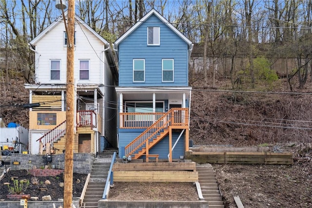 view of front of house with stairs