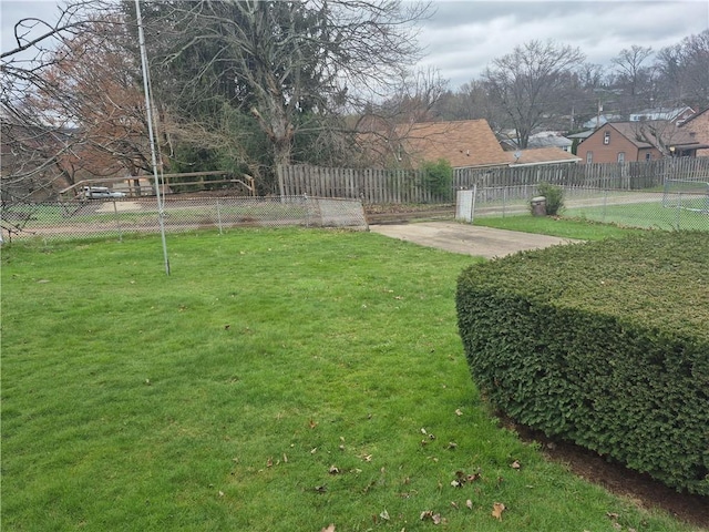 view of yard featuring a patio and fence
