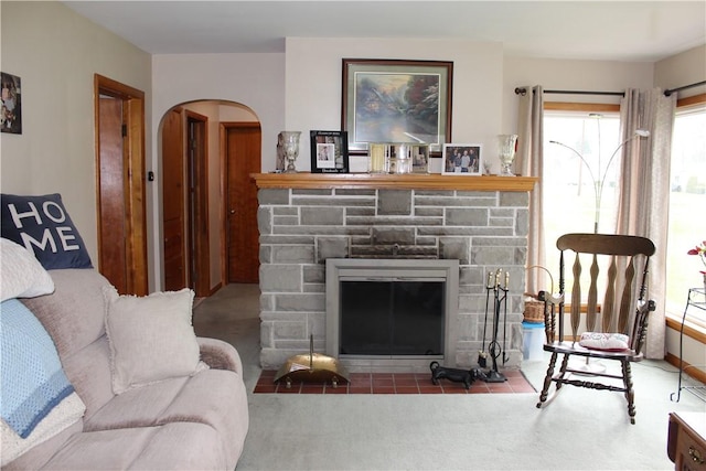 192 S Franklin, St, PA 16314 - carpeted living room with arched walkways and a stone fireplace