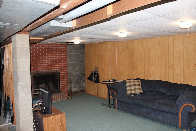 192 S Franklin, St, PA 16314 - carpeted living area with a paneled ceiling, wooden walls, and a brick fireplace