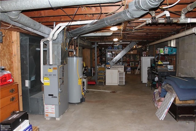 192 S Franklin, St, PA 16314 - unfinished below grade area featuring freestanding refrigerator and gas water heater