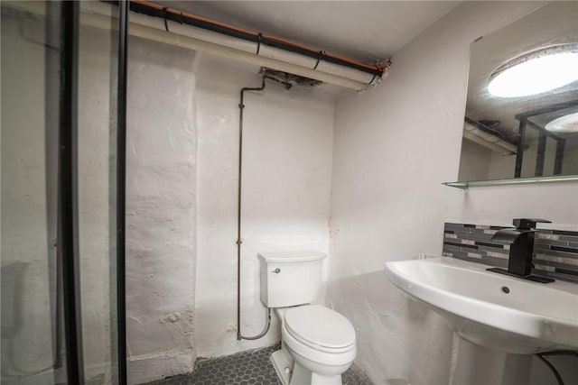 4106 Garden Way, Lawrenceville, PA 15201 - bathroom with toilet, tasteful backsplash, a sink, and tile patterned floors