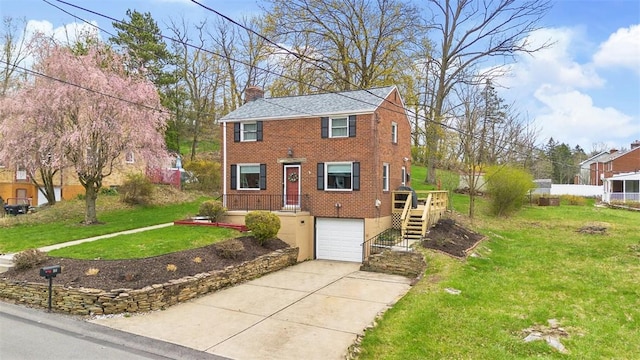 view of front of property with a garage, a chimney, concrete driveway, brick siding, and a front lawn