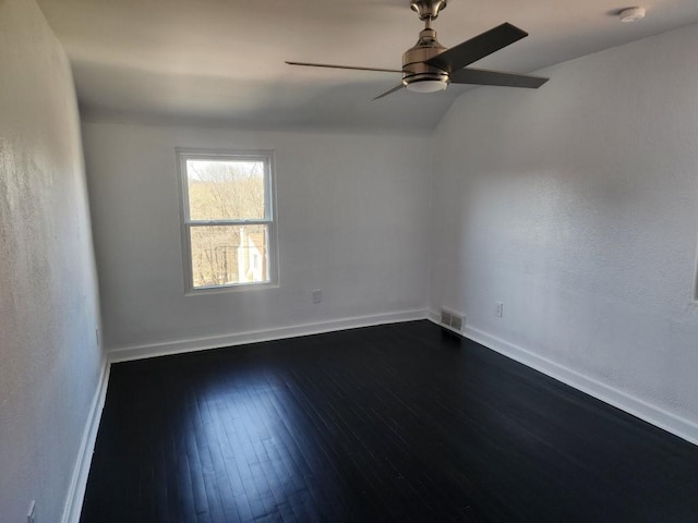 5679 Valleyview Dr, Bethel Park, PA 15102 - empty room featuring ceiling fan, dark wood-style floors, baseboards, and vaulted ceiling