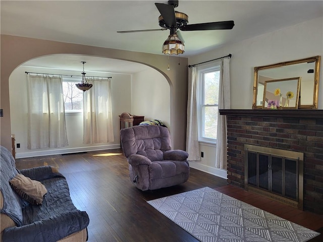 211 Oak St, City Of But Ne, PA 16001 - living area featuring a wealth of natural light, arched walkways, and hardwood / wood-style floors