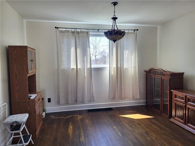 211 Oak St, City Of But Ne, PA 16001 - dining area featuring dark wood-type flooring, visible vents, and baseboards