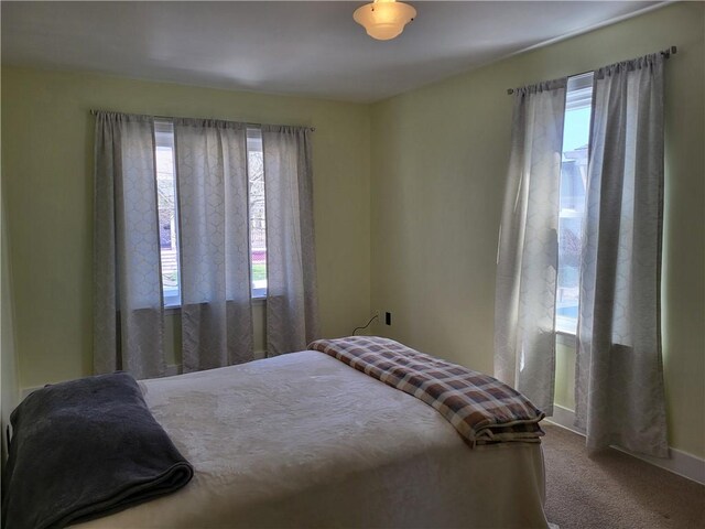 211 Oak St, City Of But Ne, PA 16001 - carpeted bedroom featuring baseboards and multiple windows