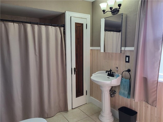 211 Oak St, City Of But Ne, PA 16001 - bathroom with wood walls and tile patterned flooring