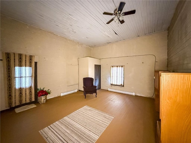 sitting room featuring baseboard heating and a ceiling fan