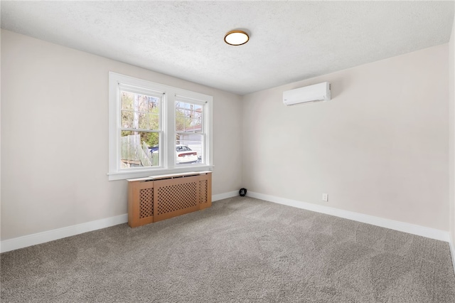 unfurnished room featuring a wall mounted AC, radiator heating unit, baseboards, and carpet flooring