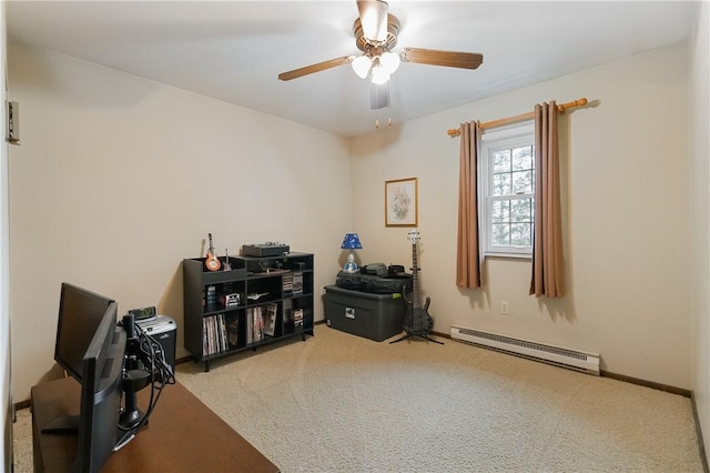 carpeted office space featuring baseboards, a ceiling fan, and a baseboard heating unit
