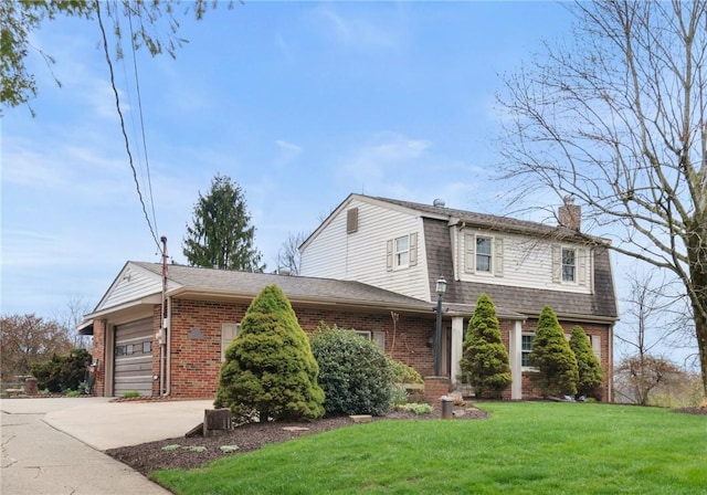 traditional home featuring a front lawn, brick siding, a chimney, a garage, and driveway