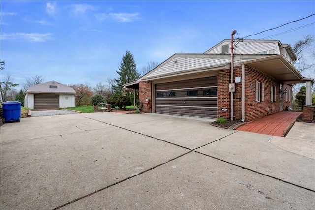 view of side of home with concrete driveway and brick siding