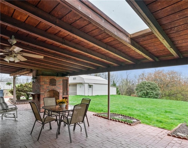 view of patio / terrace with an outdoor brick fireplace and outdoor dining space