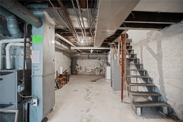 1968 Straubs Ln, Troy Hill, PA 15212 - unfinished below grade area featuring washer / clothes dryer, water heater, and stairway