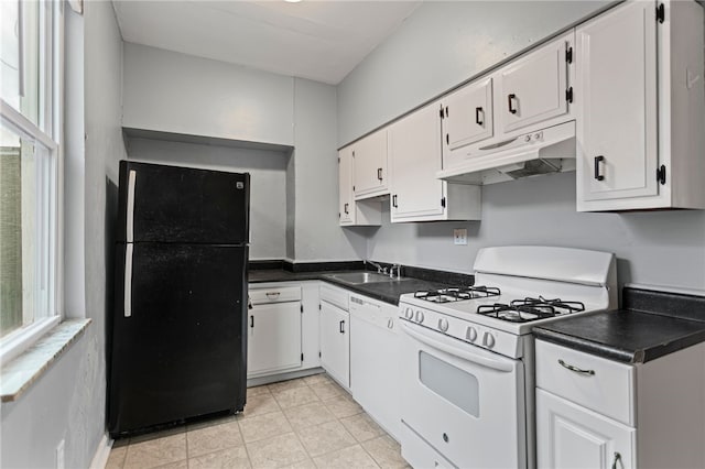 1968 Straubs Ln, Troy Hill, PA 15212 - kitchen featuring white cabinets, plenty of natural light, dark countertops, white appliances, and under cabinet range hood