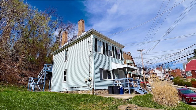 1406 Superior Ave, Brighton Heights, PA 15212 - view of side of home with a yard and a chimney