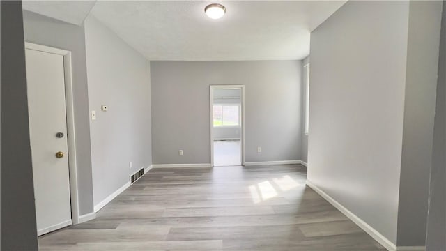 1406 Superior Ave, Brighton Heights, PA 15212 - spare room with visible vents, baseboards, and wood finished floors