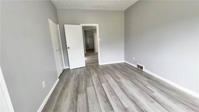 1406 Superior Ave, Brighton Heights, PA 15212 - unfurnished room featuring wood finished floors, baseboards, and visible vents