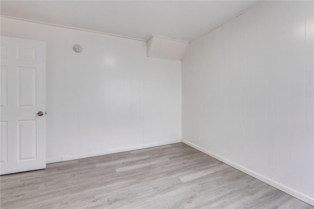 unfurnished room with wood finished floors