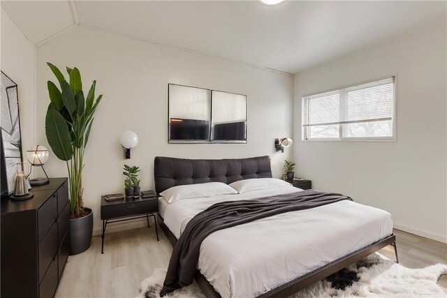 bedroom featuring light wood finished floors